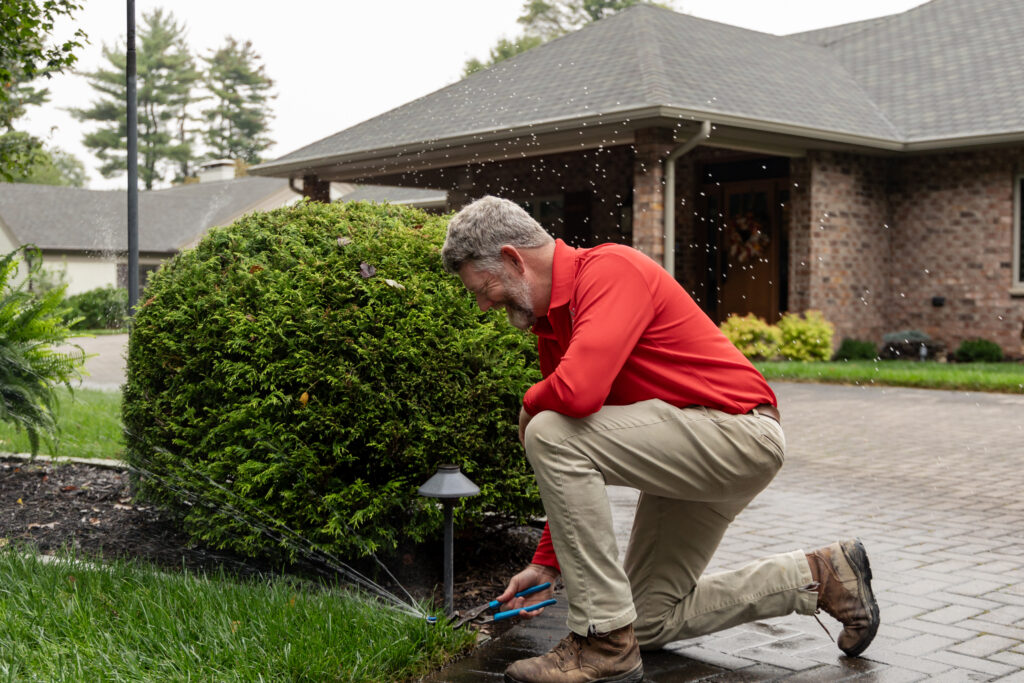 RYAN pro fixing a sprinkler