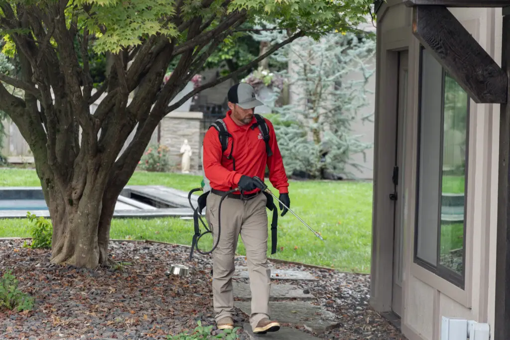 RYAN pro spraying a house for pests