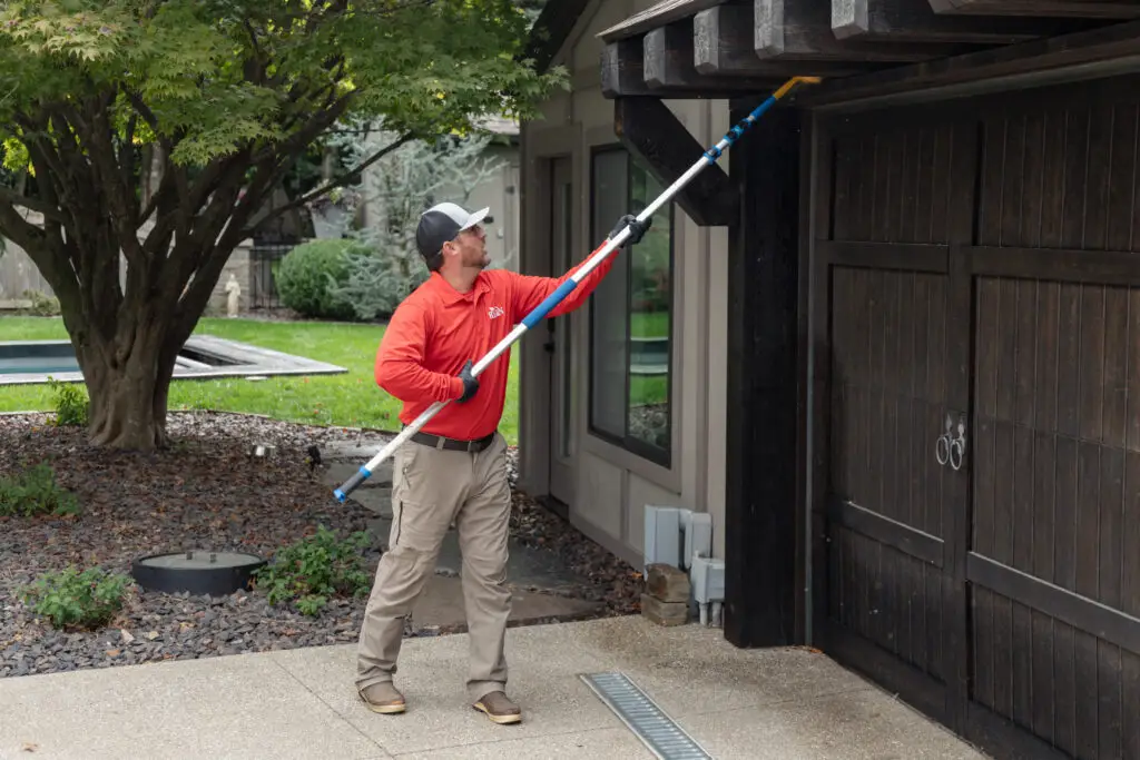 ryan pro cleaning a house exterior