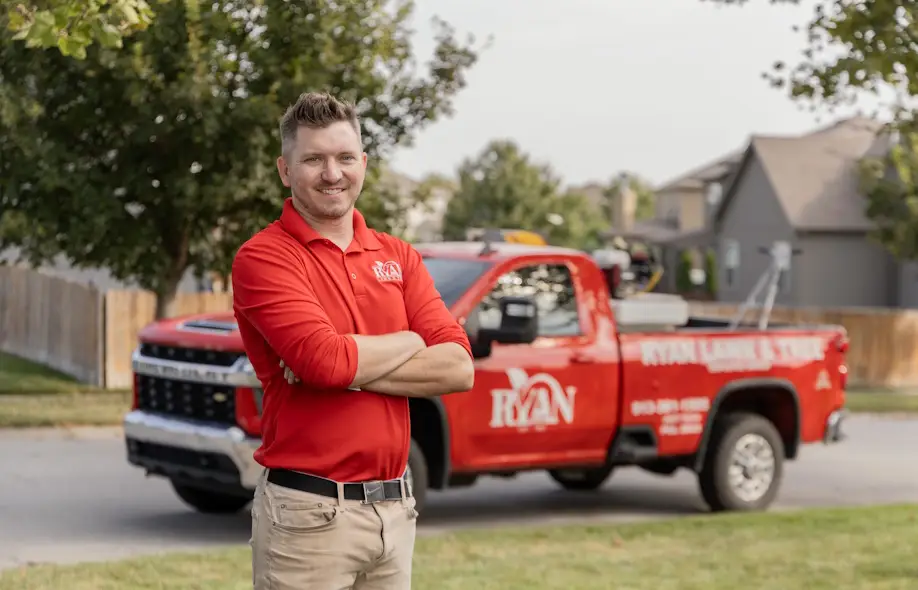 RYAN lawn pro in front of truck